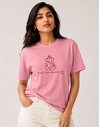 Woman modeling a baby pink unisex cotton t-shirt with a red Lord Ganapati design by Vedic Bridge.